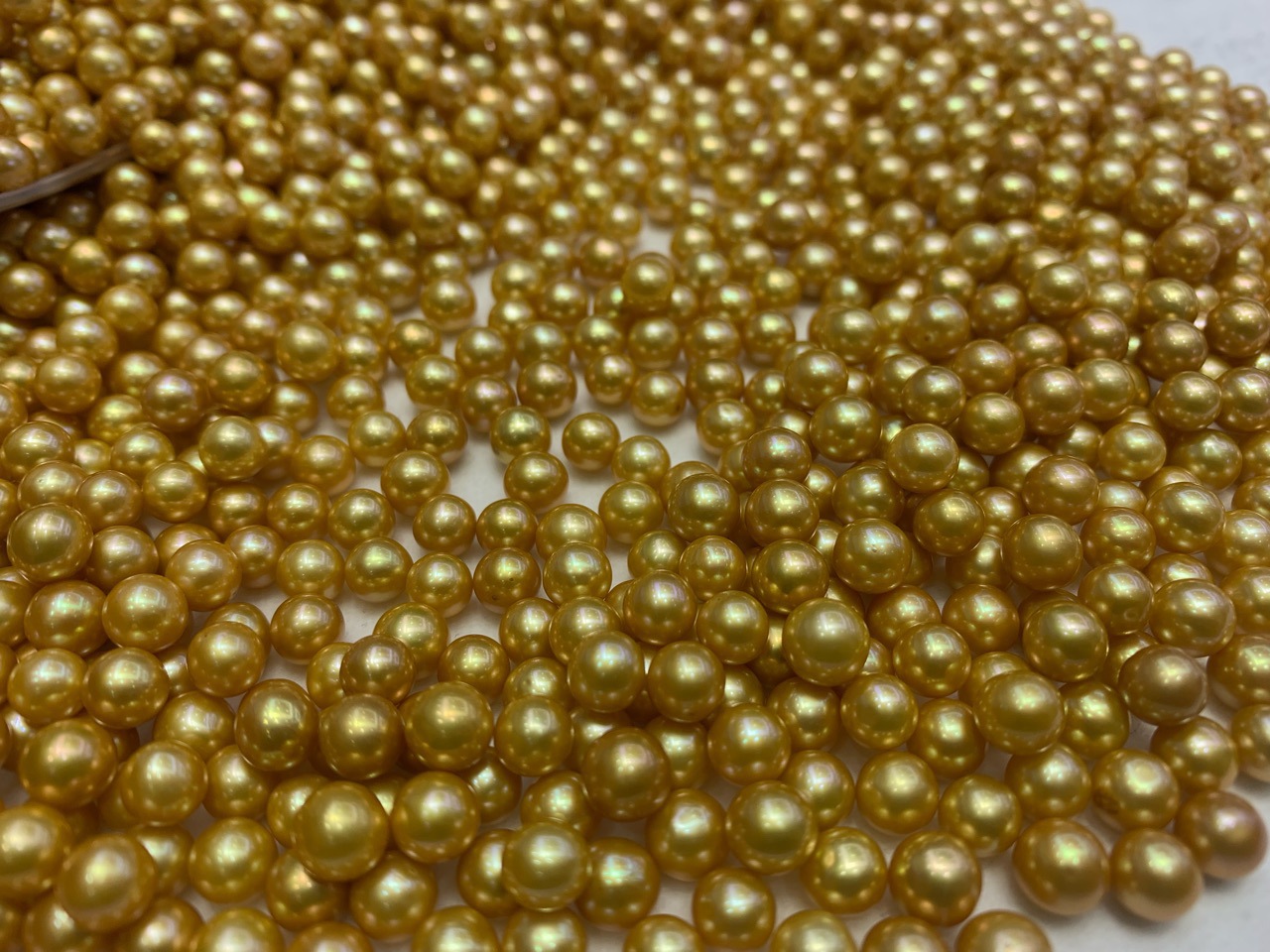 有核淡水优化金珠6-7mm统货批发圆近圆媲美南洋金珠微瑕孔后无瑕