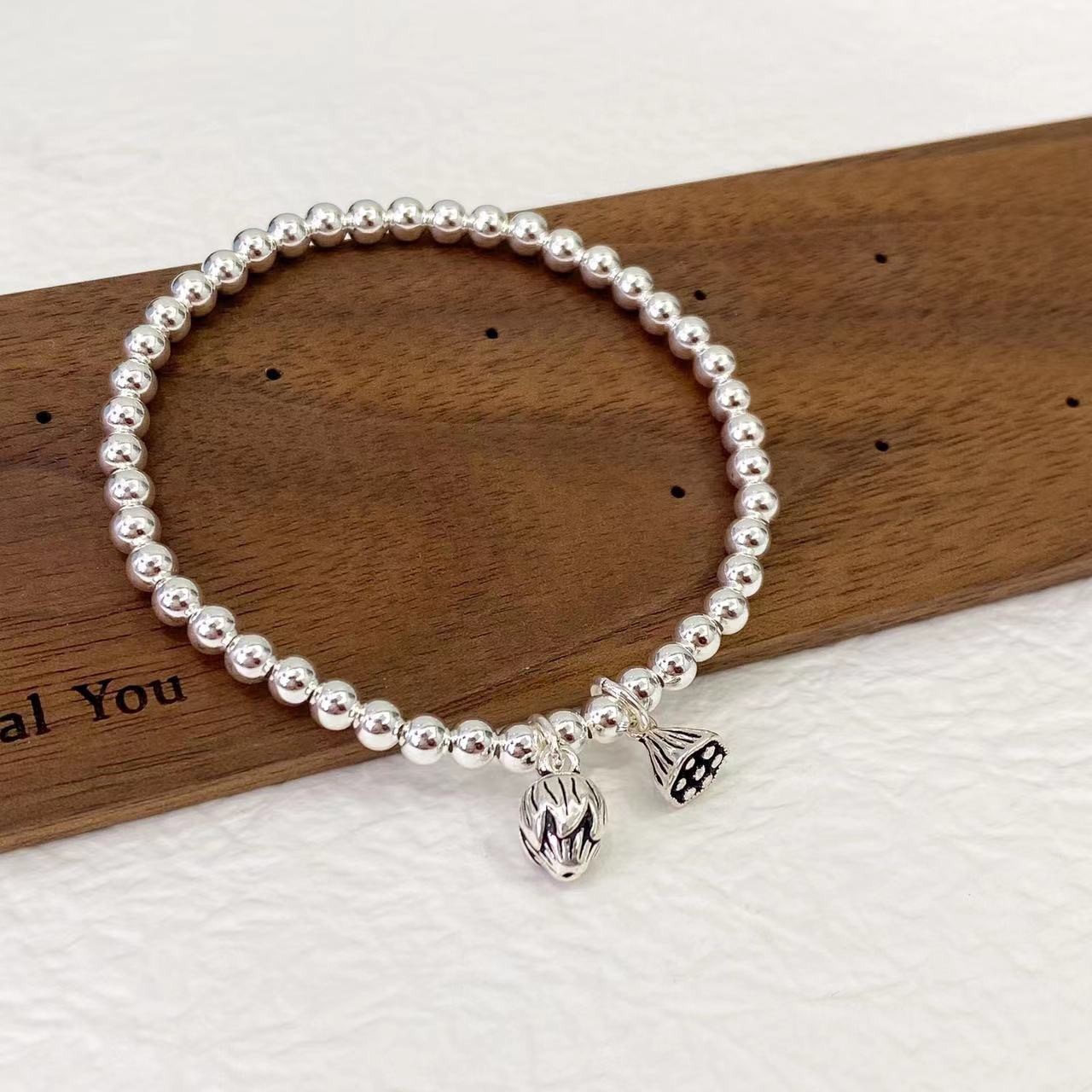 s925纯银两世欢手链女时尚手饰莲心莲蓬弹力绳串珠手串送女友礼物