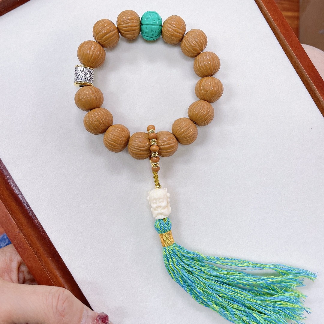 新款 设计文玩批发凤羽猴头单圈手链手持搭配菱镁矿藏银象牙果等