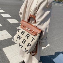 韩国小众设计字母帆布双肩包潮牌包包女2021新款大容量凯莉手提包