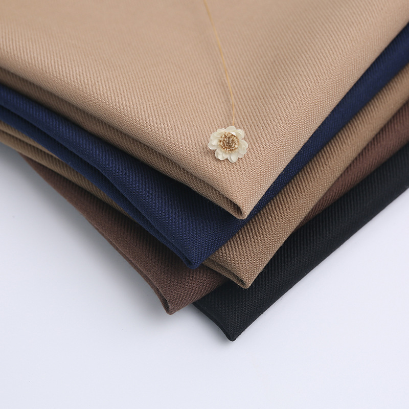 精纺薄呢30%羊毛单面斜纹毛呢面料 春秋素色裤装精纺羊毛西服布料