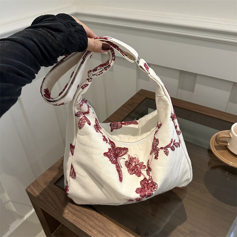 韩国东大门蝴蝶碎花帆布包女2024新款时尚印花单肩包学生腋下包包