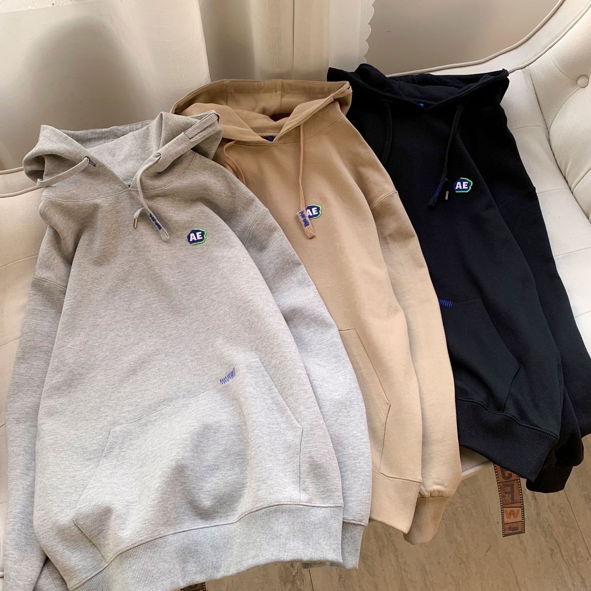 现货小众潮牌ader千玺同款连帽卫衣ae刺绣小标破洞宽松情侣款帽衫