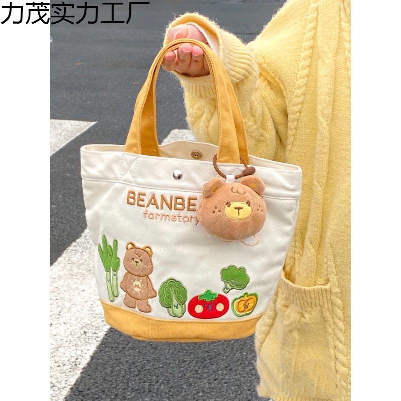 帆布包卡通字母水桶手提包便当包妈咪包溜娃袋帆布手提母婴包布包