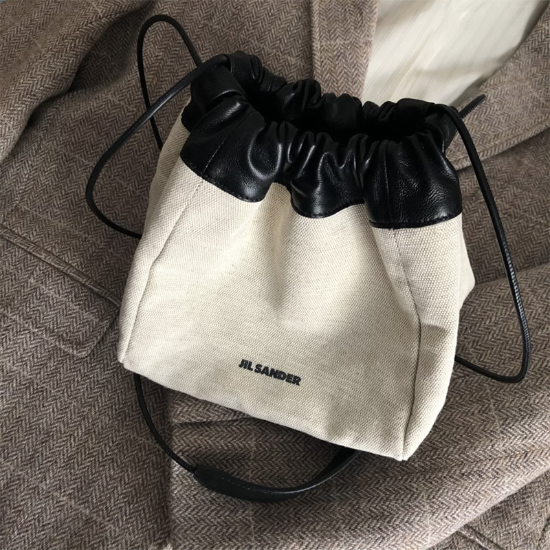 正确版本 jil sander 抽绳帆布双面水桶包斜跨小笼皮包简约ins风