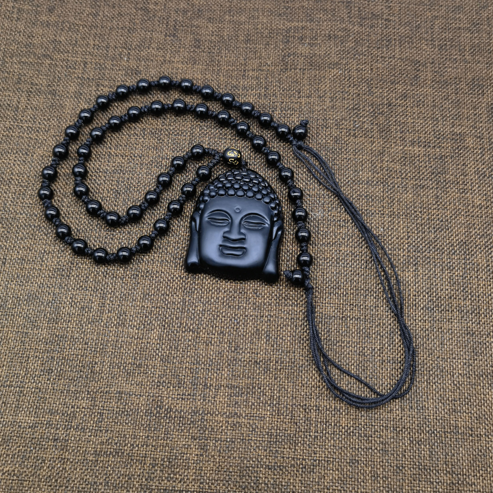 跨境热卖黑曜石项链男款释迦摩尼佛头挂坠地摊景区货源礼品批发