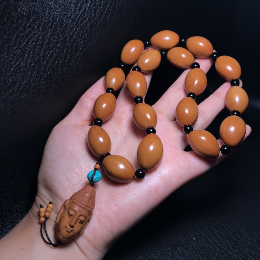 厂家直供橄榄核雕如来手持手串盘玩招财转运文玩橄榄核佛珠手链