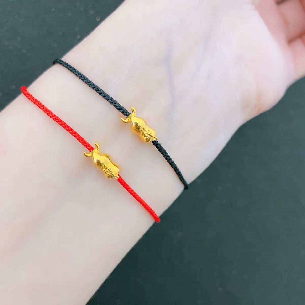 纯黄金生肖牛手绳硬金一定牛999足金小金牛红绳开运牛情侣款手链