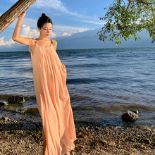 橘色显白度假吊带连衣裙女夏宽松海边拍照沙滩长裙法式露背仙女裙
