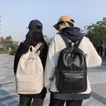 新品防泼水书包女韩版时尚潮流PU黑色双肩包男大容量电脑双肩包