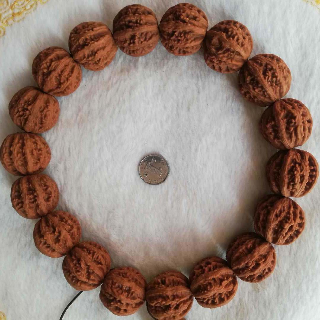 文玩核桃野生山核桃秋子手持手串手把件脖挂磨盘白狮子官帽狮子头