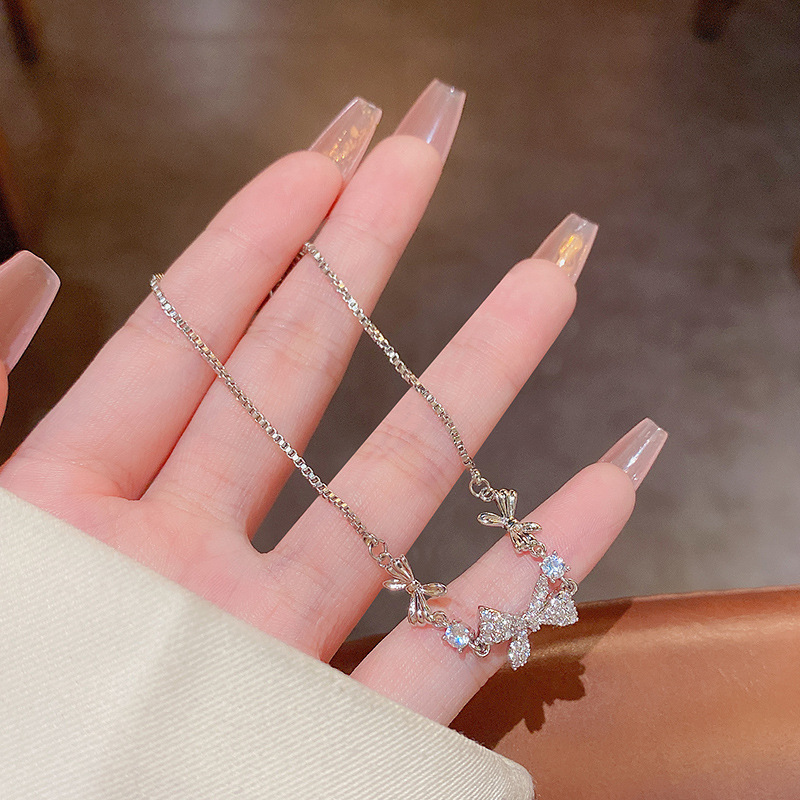 Korean Hot-Selling Micro-Inlaid Full Diamond Bow Titanium Steel Necklace Female Ins Trendy Light Luxury Minority Pull Bracelet Two-Piece Set