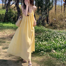 度假风黄色吊带连衣裙夏季2024新款温柔仙女裙气质显瘦A字长裙潮
