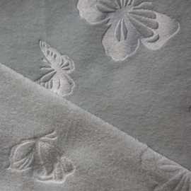 爆款热销单面双面氨纶超柔海岛绒蝴蝶压花花型家居服时装面料