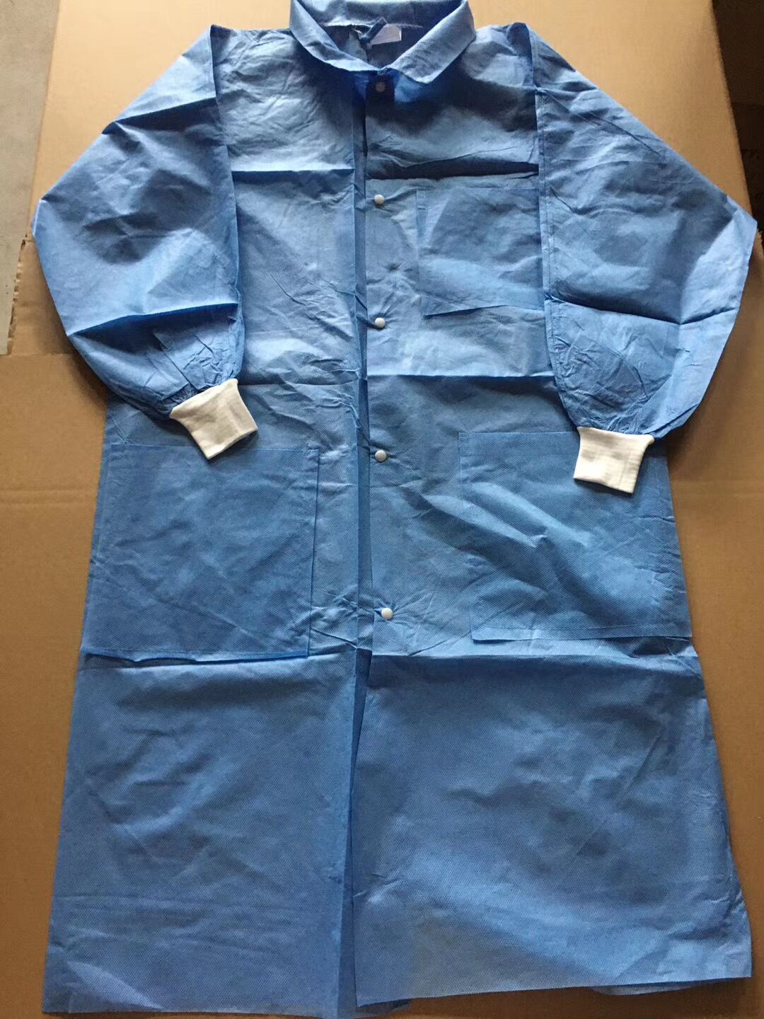 厂家现货sms无纺布实验服 一次性长袍实验服带口袋蓝色大褂工作服-阿