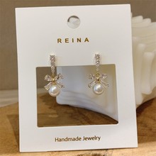 高级感白珍珠蝴蝶结锆石耳环S925银针淑女耳钉小众设计感女款耳饰