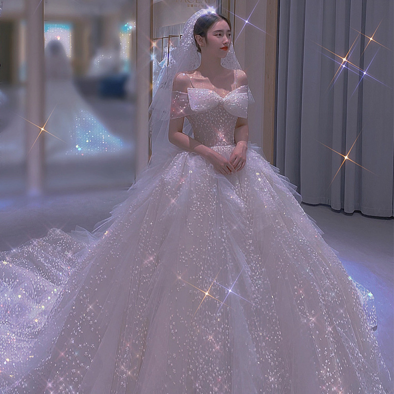 一字肩主婚纱2022新款新娘大拖尾星空法式轻婚纱重工超仙抹胸婚纱