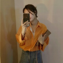橙色长袖衬衫女2022春秋韩国设计师别致衬衣小众百搭单排扣22497