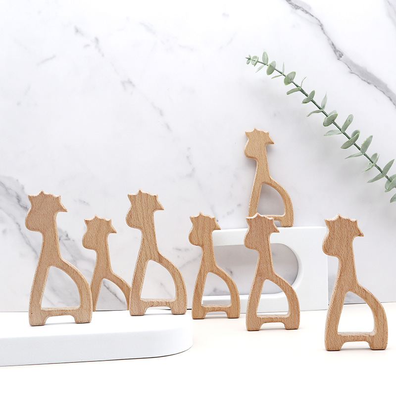 厂家定制木质牙胶婴儿磨牙玩具配件销售卡通动物造型镂空榉木牙胶