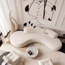 北欧现代美容美发会所酒店民宿工作室设计师创意弧形异形布艺沙发