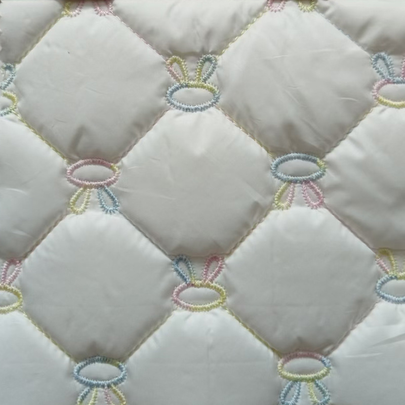 绣花面料涤纶布 绗缝夹棉包段染纱绳绣爱心箱包棉衣棉服刺绣布料