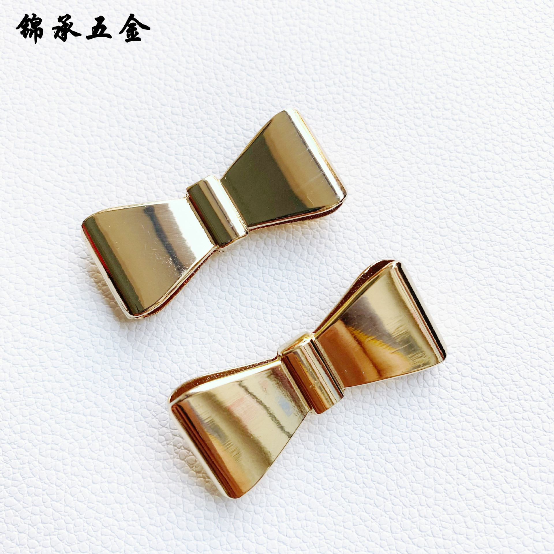 批发服饰五金配件 合金蝴蝶结扣 金属标牌五金蝴蝶扣