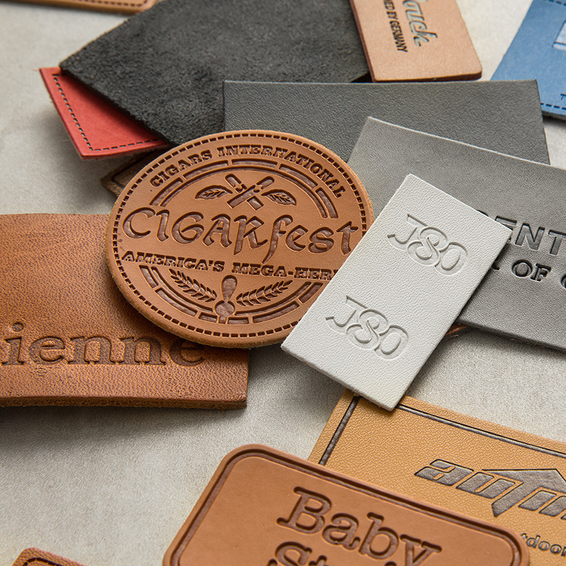 厂家pu皮牌定制 压印牛仔裤服装商标电压色皮革软标订做 皮标定做