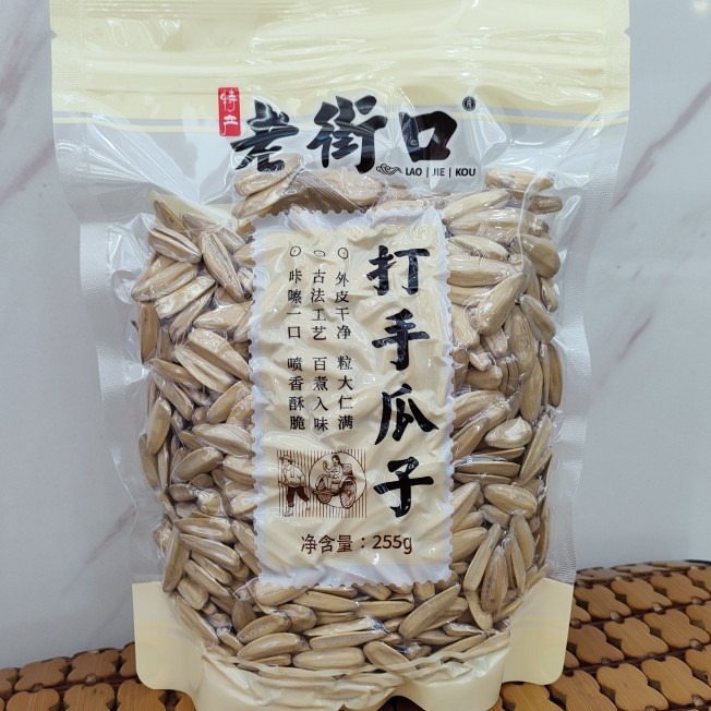 老街口255g打手瓜子大颗粒脱皮白葵花籽网红休闲零食-阿里巴巴