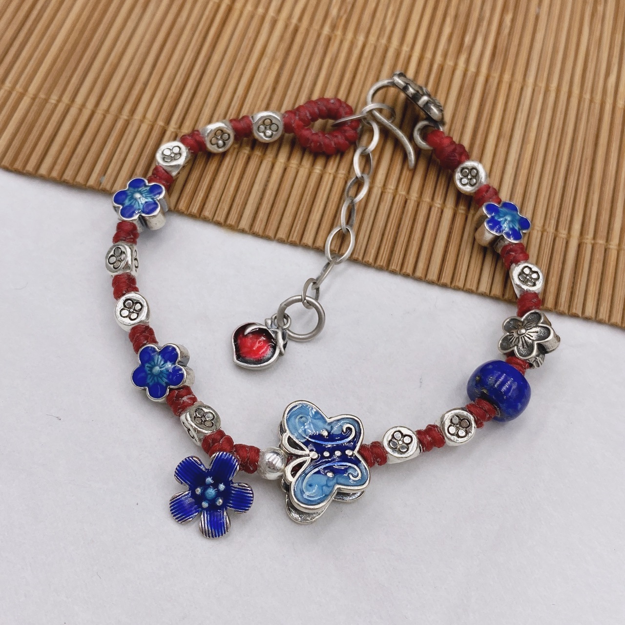 s925纯银烧蓝滴胶蝴蝶小花青金石三角珠蜡绳编织手链可调节手串