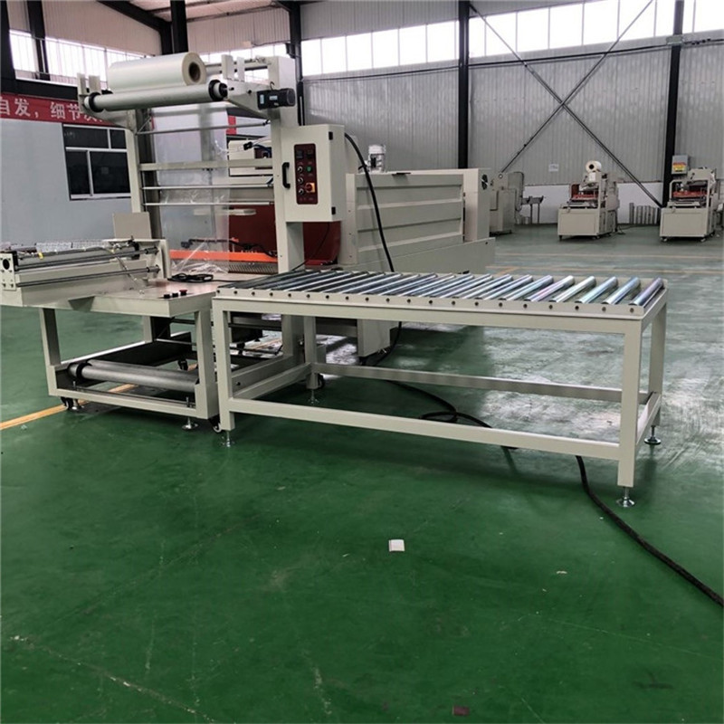 半自动袖口热收缩包装机 pe膜加强型纸箱塑包机 6540型封切机视频