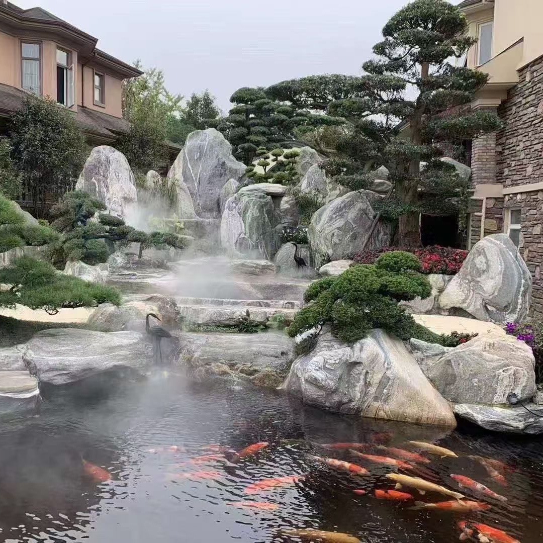 庭院泰山石假山流水造景产地供应泰山石景观刻字石草坪泰山石点缀