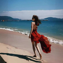 三亚红色海边度假沙滩裙女2024年夏季新款性感露背超仙吊带连衣裙