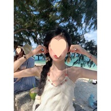 纯欲海边沙滩度假裙夏季新款挂脖露背吊带连衣裙女仙绑带长裙