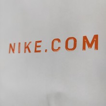 耐克 NIKE 白牛皮纸袋手提袋 UV 烫金橘绳激凸起鼓鞋服礼品购物袋