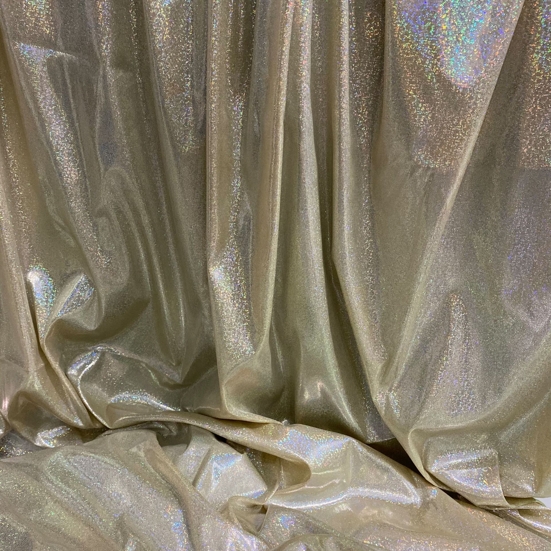 镭射幻彩针织布七彩闪亮点满版烫金布料舞台演出服装拍摄背景面料