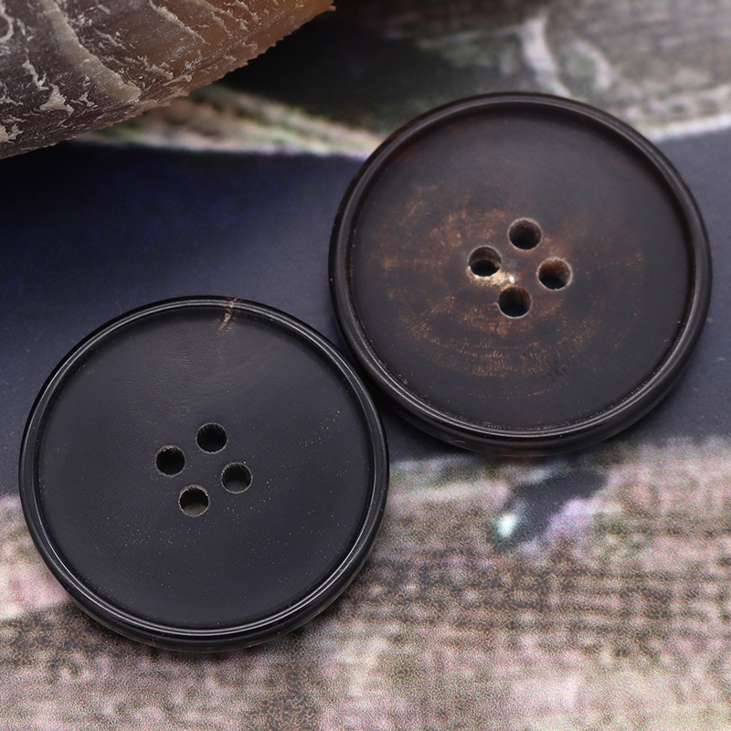 现货真牛角扣西服四眼纽扣扣子高档西装风衣大衣黑色钮扣配件批发