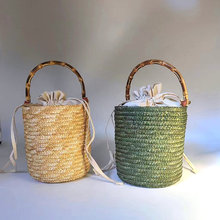 新款水桶包麦秆草女士手提包真竹子把手大气手工编织花篮森系女包