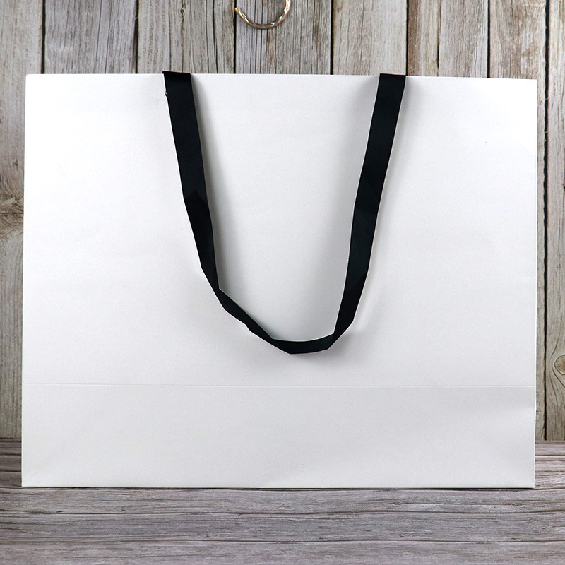 手提纸袋白色加大号服装店羽绒大衣包装袋子高档白卡纸超大礼品袋
