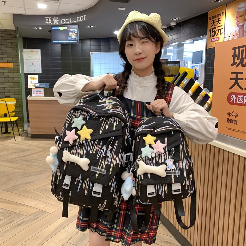 小众设计感休闲书包女孩初中生高中生双肩包女星星装饰褶皱感背包