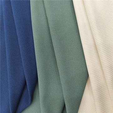 现货仿棉华夫格面料 涤纶单面十字格布料 春秋弹力格纹卫衣料批发