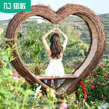网红打卡民宿室外藤编心型鸟巢景区拍照道具大型爱心户外吊椅秋千