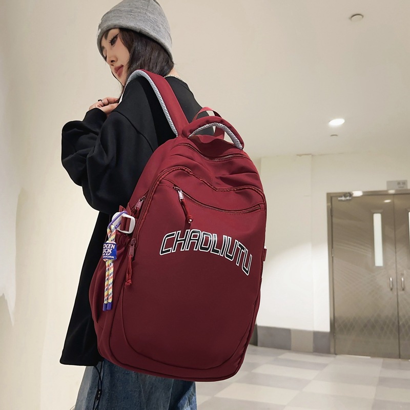 书包初高中生高颜值字母双肩包ins复古港风潮流大学生情侣双肩包