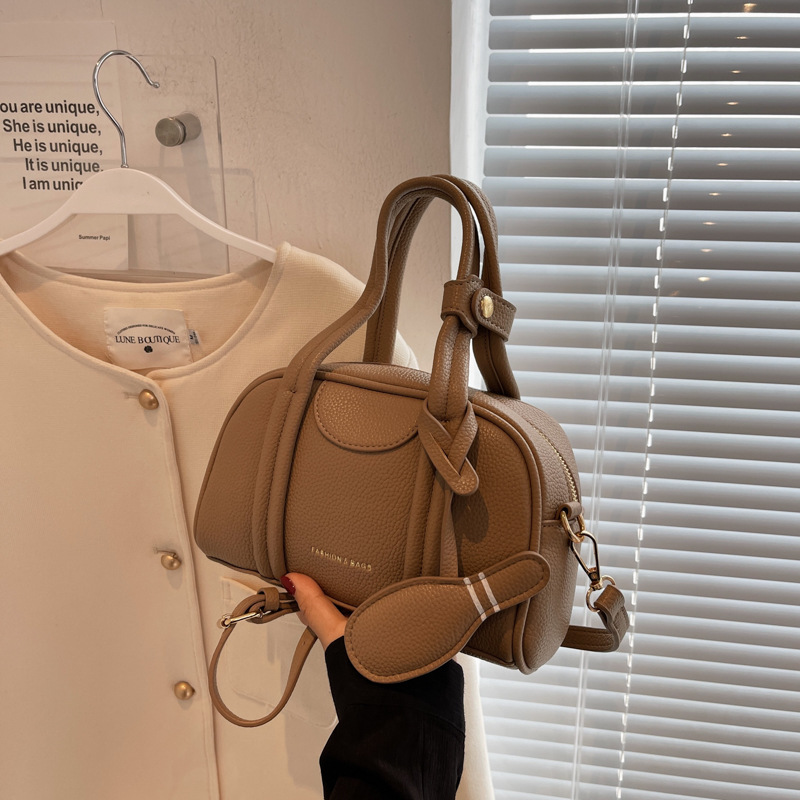 2022 New Niche Designer Songmont Bowling Bag Boston round Bag Women's Bag Hand Holding Pillow Bag