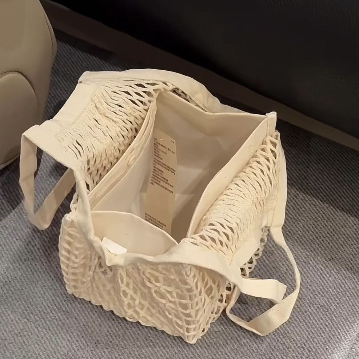 小红书爆火同款棉质夏季编织镂空手提包女小众设计网兜包包女批发