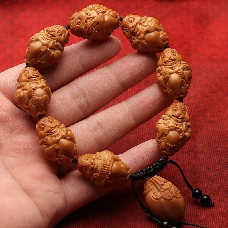 新品橄榄核手工雕刻金钱兔手串核雕十二生肖兔进宝手链文玩-阿里巴巴
