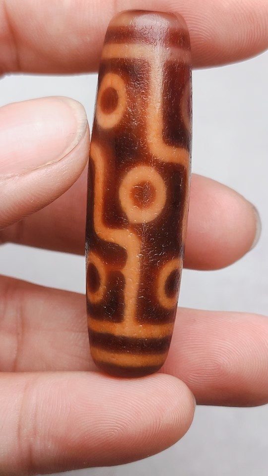 藏区老料朱砂龙鳞纹古法措丝水纹九眼天珠桔皮红肉朱14.6x51.3mma