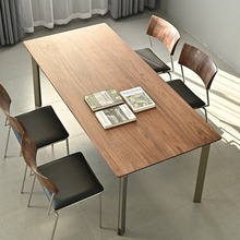 北欧黑胡桃木餐桌家用长方形不锈钢长桌现代轻奢实木桌子中古风桌