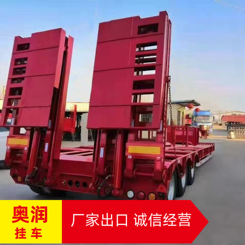 13米低平板半挂车出口非洲 液压爬梯低平板运输半挂车 全新轮胎