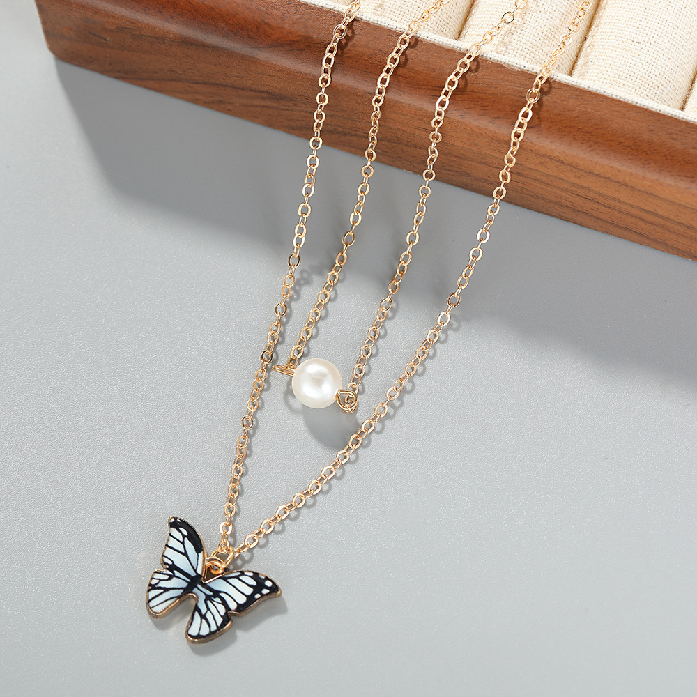 跨境热销珍珠蝴蝶饰品时尚百搭滴油蝴蝶吊坠项链耳环手链首饰套装