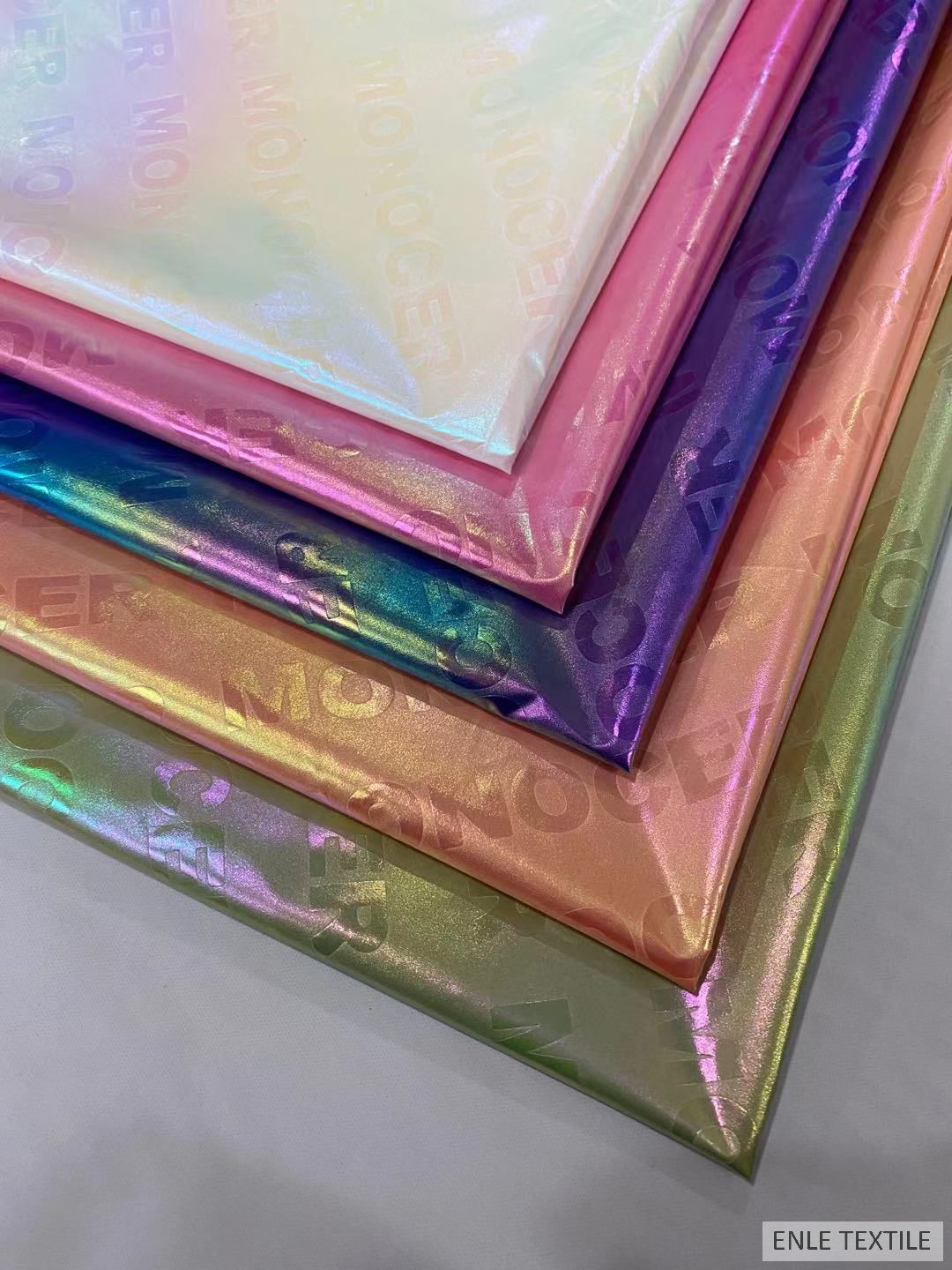 春亚纺幻炫彩珠光字母 离型纸转移膜 幻彩烫金羽绒服面料高亮七彩